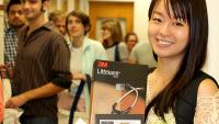 Female student holding a P&S textbook.